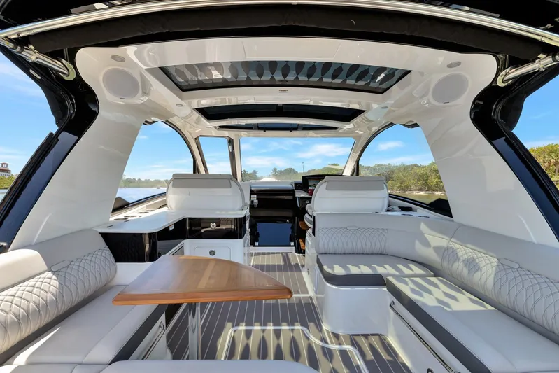  Yacht Photos Pics Luxurious interior of 2024 Sea Ray Sundancer 370 Outboard with elegant seating and panoramic views.