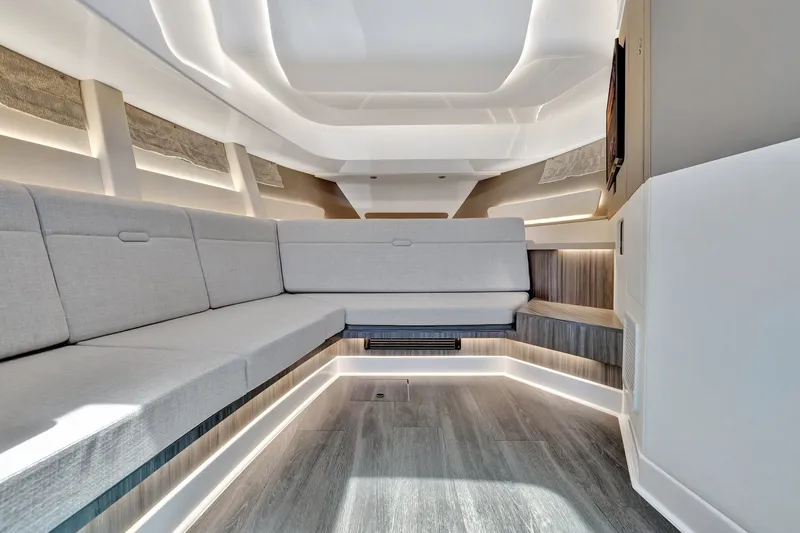  Yacht Photos Pics Luxurious interior of 2024 Sea Ray Sundancer 370 Outboard with modern seating and ambient lighting.