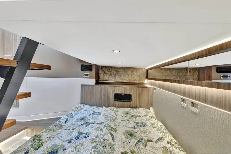  Yacht Photos Pics 2024 Sea Ray Sundancer 370 Outboard cabin interior with modern design and floral bedding.