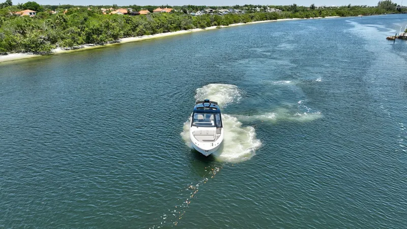  Yacht Photos Pics 2024 Sea Ray Sundancer 370 Outboard cruising on a scenic waterway.