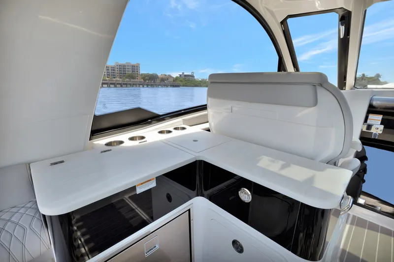  Yacht Photos Pics 2024 Sea Ray Sundancer 370 Outboard interior with sleek seating and water view.