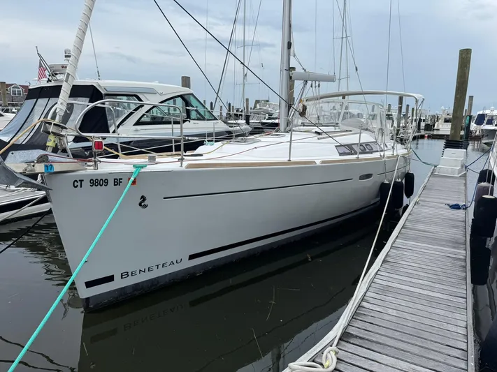Bel Canto Yacht Photos Pics 2014 Beneteau 37 sailboat docked at marina, side view.