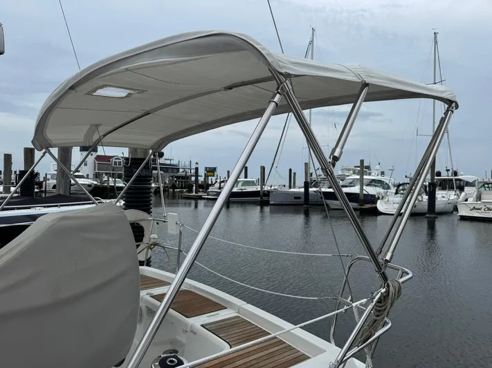 Bel Canto Yacht Photos Pics 2014 Beneteau 37 sailboat with bimini top docked at marina.