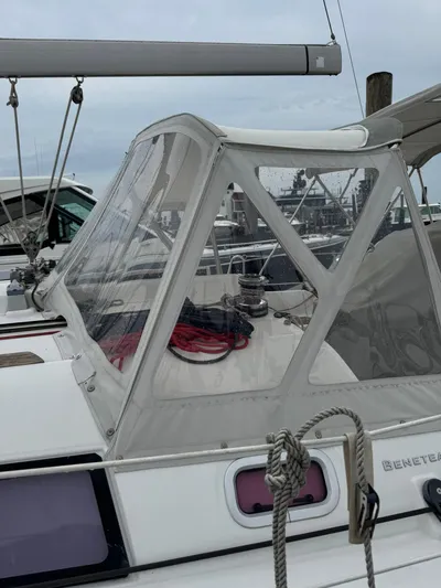 Bel Canto Yacht Photos Pics 2014 Beneteau 37 sailboat with clear cockpit enclosure at marina.