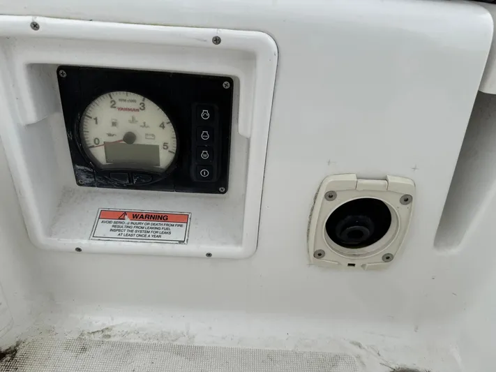Bel Canto Yacht Photos Pics Control panel of a 2014 Beneteau 37 sailboat with warning label and gauge.