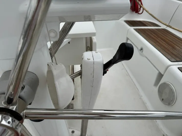 Bel Canto Yacht Photos Pics Cockpit controls of a 2014 Beneteau 37 sailboat, featuring a throttle lever and seating area.