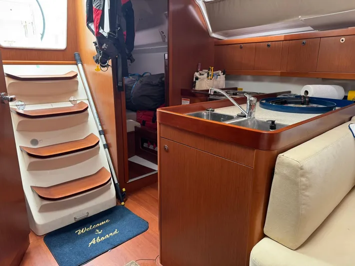 Bel Canto Yacht Photos Pics Interior of 2014 Beneteau 37 sailboat with galley and stairs.