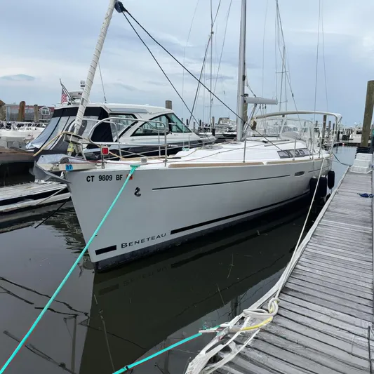 Bel Canto Yacht Photos Pics 2014 Beneteau 37 sailboat docked at marina, side view.