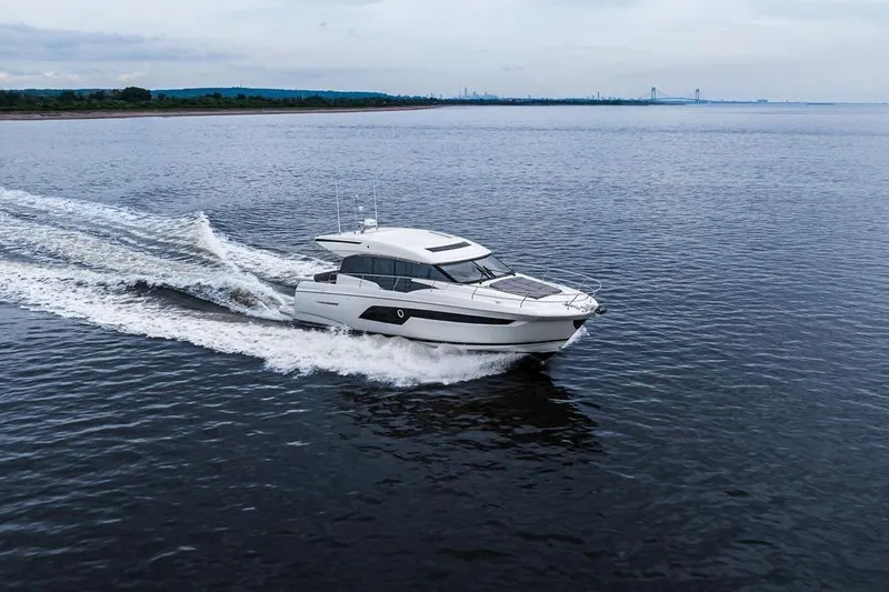  Yacht Photos Pics Luxury 2022 Prestige 520S yacht cruising on open water.