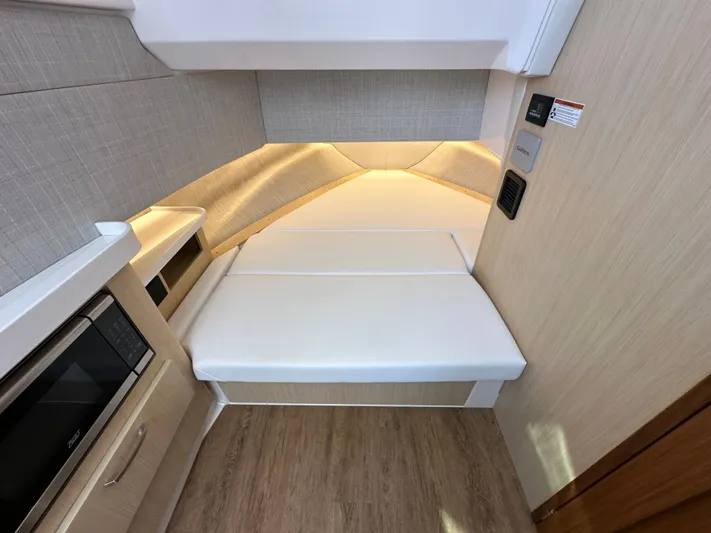  Yacht Photos Pics 2026 Regal 38 SAV interior cabin with modern design and cozy sleeping area.