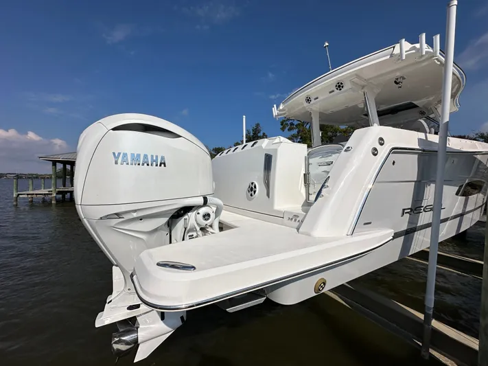  Yacht Photos Pics 2026 Regal 38 SAV boat with Yamaha outboard motor on a sunny day.
