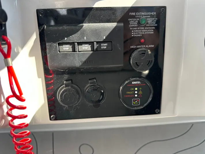  Yacht Photos Pics Control panel of a 2026 Regal 38 SAV boat with safety indicators.