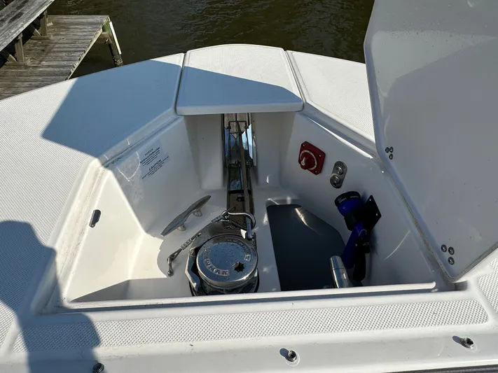  Yacht Photos Pics Open anchor compartment on 2026 Regal 38 SAV boat, showing anchor and winch system.