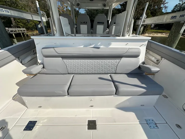  Yacht Photos Pics 2026 Regal 38 SAV boat interior with sleek gray seating and modern design.