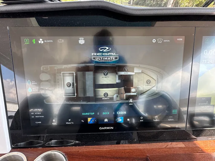  Yacht Photos Pics Touchscreen display of 2026 Regal 38 SAV boat control panel with cabin layout.