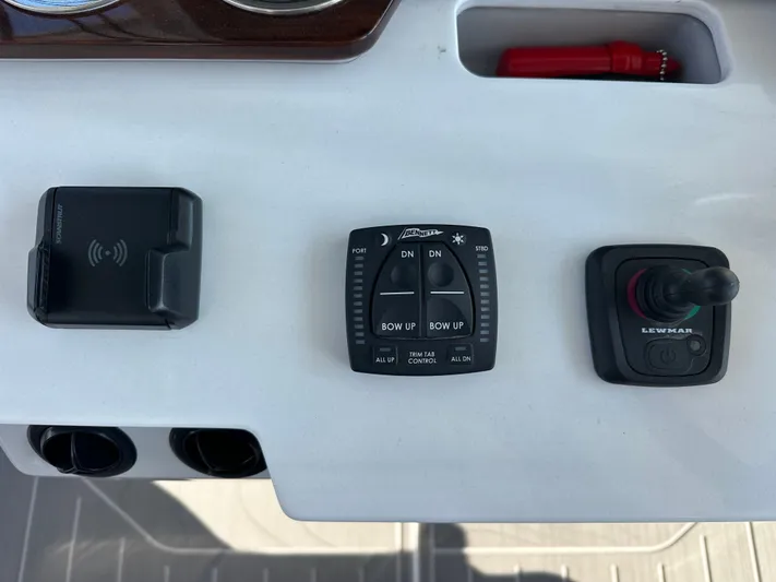  Yacht Photos Pics Control panel of 2026 Regal 38 SAV boat with trim tab and joystick controls.