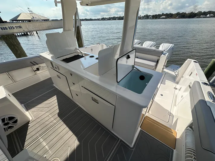  Yacht Photos Pics 2026 Regal 38 SAV boat interior with sleek design and modern amenities by the water.