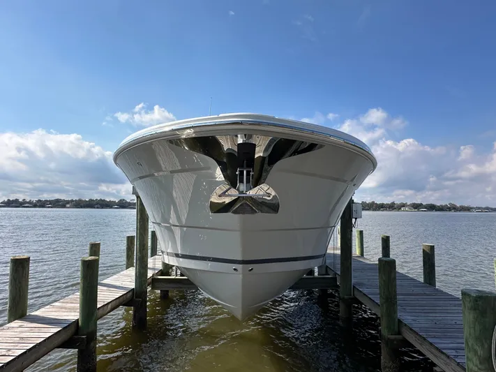  Yacht Photos Pics 2026 Regal 38 SAV boat docked on a sunny day, viewed from the front.