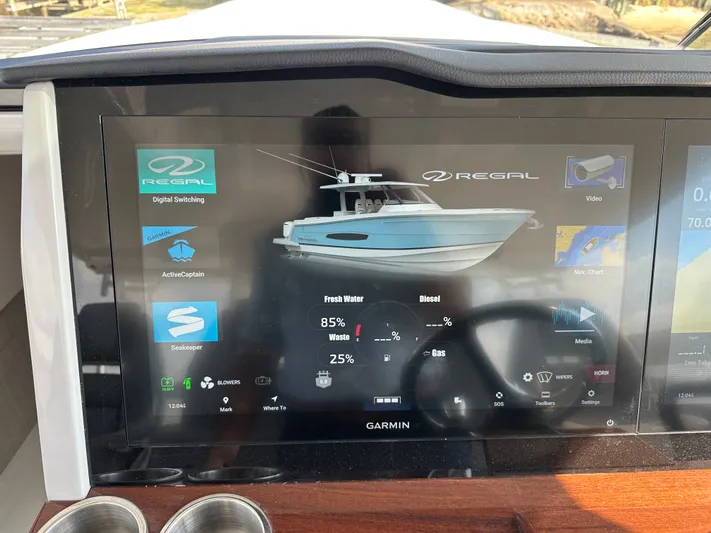  Yacht Photos Pics 2026 Regal 38 SAV boat dashboard display with Garmin navigation and system controls.