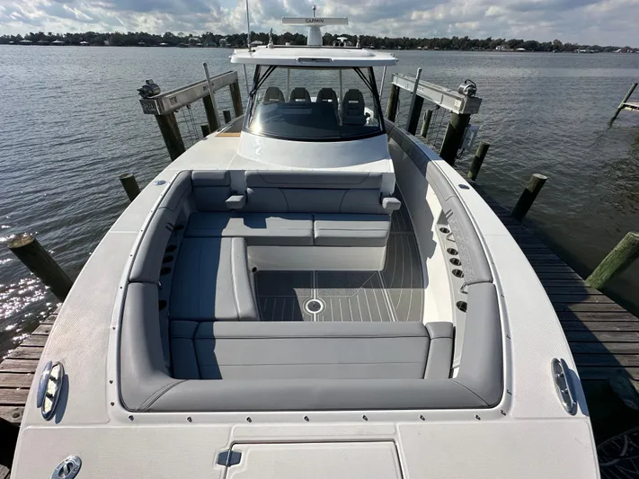  Yacht Photos Pics 2026 Regal 38 SAV boat docked, featuring spacious seating and sleek design.