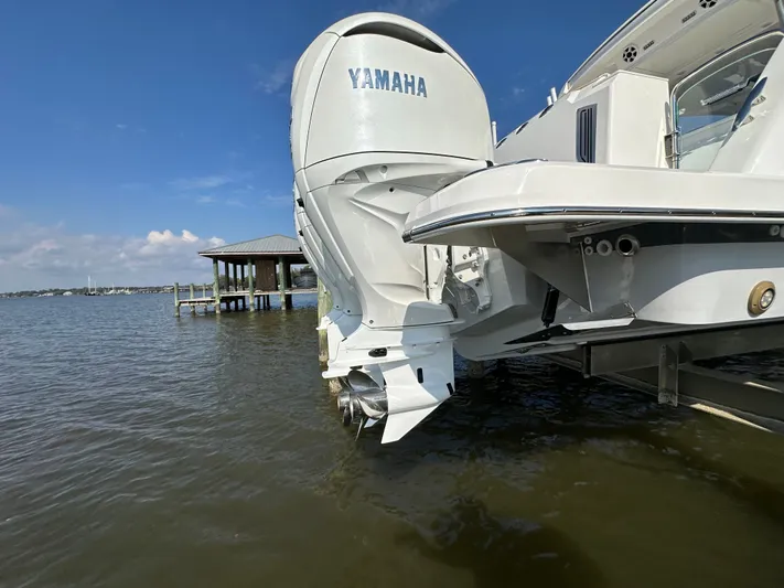  Yacht Photos Pics 2026 Regal 38 SAV boat with Yamaha outboard engine on water.