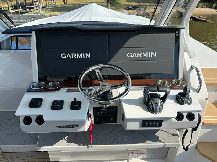  Yacht Photos Pics 2026 Regal 38 SAV boat dashboard with Garmin displays and modern controls.
