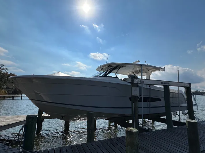  Yacht Photos Pics 2026 Regal 38 SAV boat docked under a bright sunlit sky.