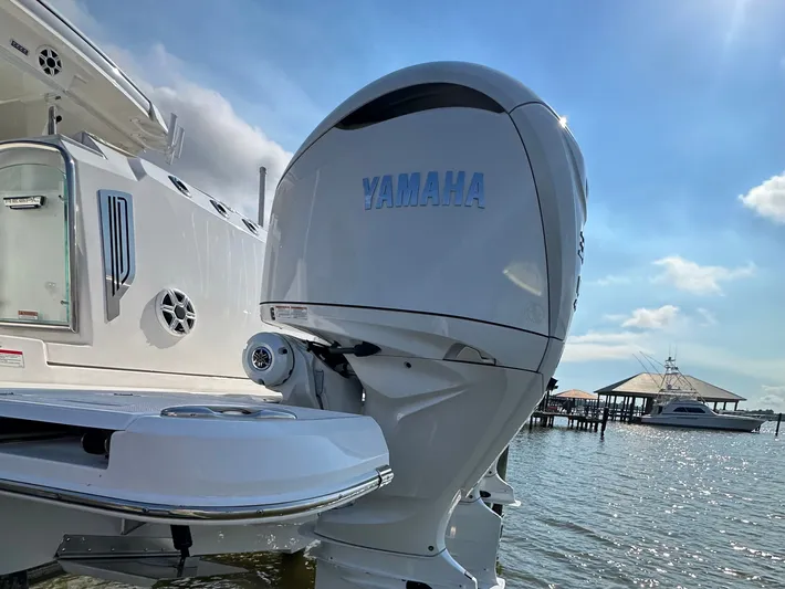  Yacht Photos Pics 2026 Regal 38 SAV boat with Yamaha outboard engine on a sunny day.