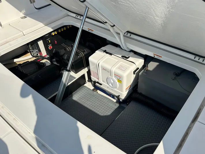  Yacht Photos Pics 2026 Regal 38 SAV boat storage compartment with equipment and gear.