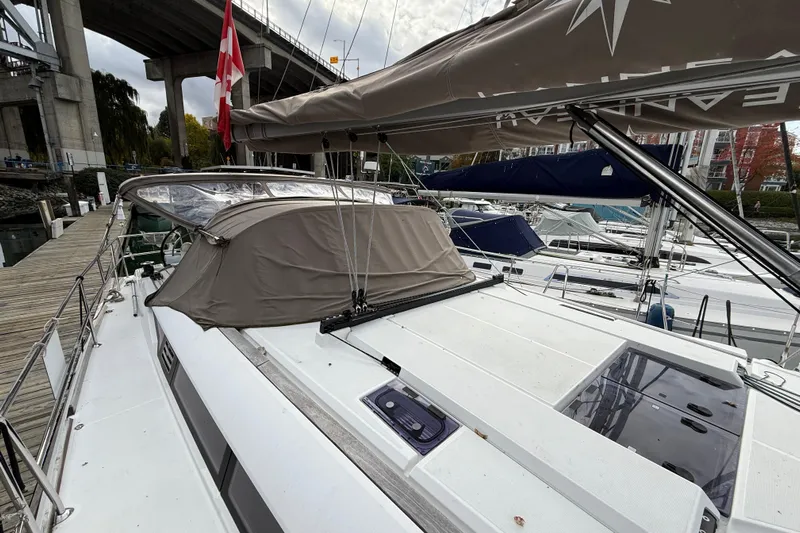 Shaboom Yacht Photos Pics 2017 Jeanneau Sun Odyssey 479 sailboat docked, featuring a covered cockpit and sleek design.