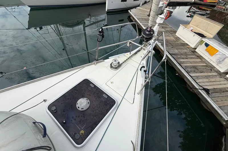 Shaboom Yacht Photos Pics 2017 Jeanneau Sun Odyssey 479 yacht docked, showing deck and mooring details.