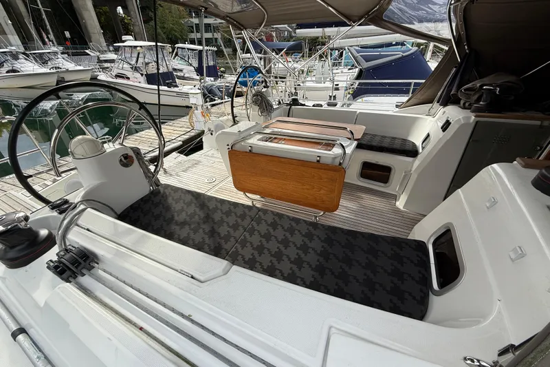 Shaboom Yacht Photos Pics Cockpit of 2017 Jeanneau Sun Odyssey 479 yacht with dual steering wheels and seating.