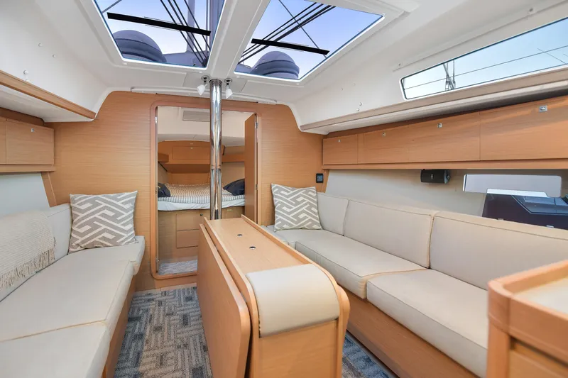 Mayne Deck Yacht Photos Pics Interior of 2019 Dufour 382 Grand Large yacht, featuring modern seating and natural light.