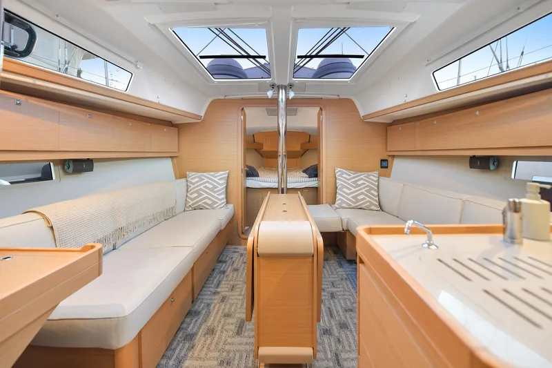 Mayne Deck Yacht Photos Pics Interior of 2019 Dufour 382 Grand Large yacht, featuring modern design and comfortable seating.