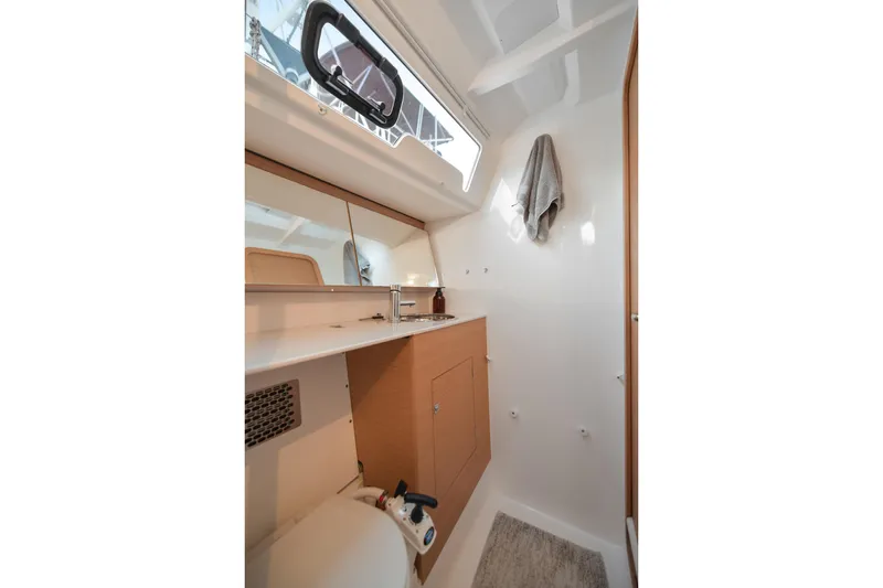 Mayne Deck Yacht Photos Pics 2019 Dufour 382 Grand Large yacht bathroom with modern fixtures and natural light.