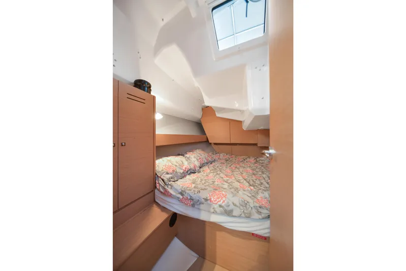 Mayne Deck Yacht Photos Pics Cozy cabin interior of 2019 Dufour 382 Grand Large sailboat with floral bedding.
