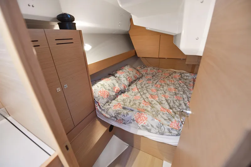 Mayne Deck Yacht Photos Pics Cozy cabin interior of 2019 Dufour 382 Grand Large with floral bedding.