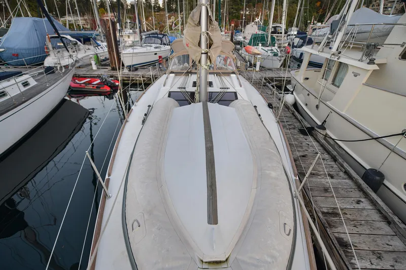 Mayne Deck Yacht Photos Pics 2019 Dufour 382 Grand Large sailboat docked among other boats in a marina.