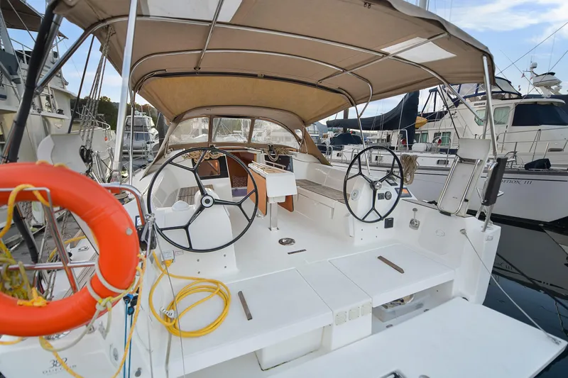 Mayne Deck Yacht Photos Pics 2019 Dufour 382 Grand Large sailboat cockpit with dual steering wheels and canopy.