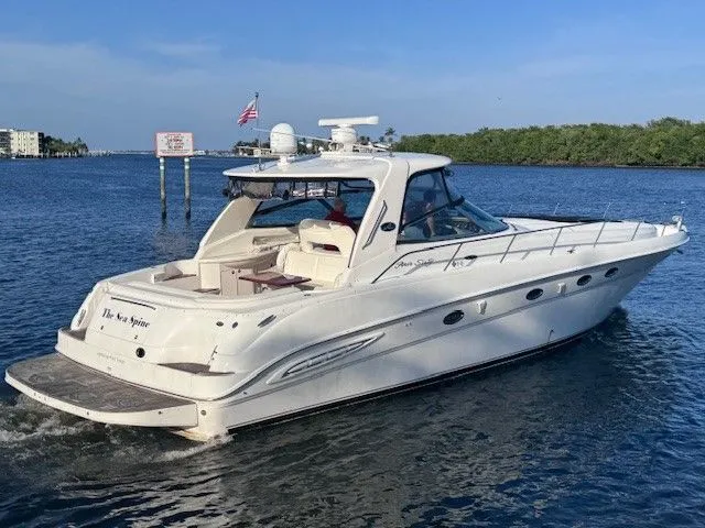  Yacht Photos Pics 2002 Sea Ray 460 Sundancer yacht on calm waters.