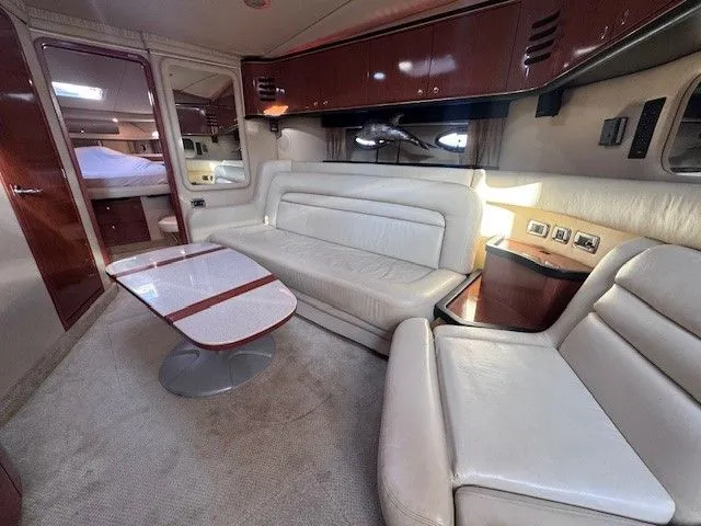  Yacht Photos Pics Interior of a 2002 Sea Ray 460 Sundancer yacht with leather sofas and wooden cabinetry.