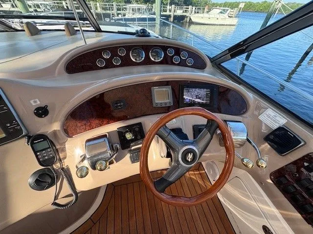  Yacht Photos Pics 2002 Sea Ray 460 Sundancer cockpit with wooden steering wheel.