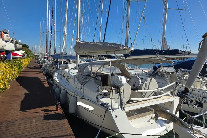  Yacht Photos Pics 2010 Hanse 400e yacht docked at marina, surrounded by other sailboats under clear blue sky.