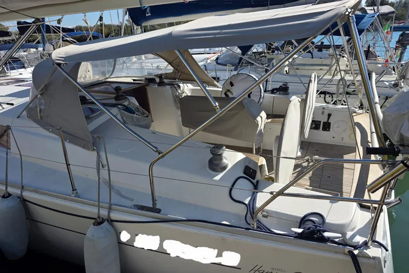  Yacht Photos Pics 2010 Hanse 400e sailboat docked, featuring a spacious cockpit and protective canopy.