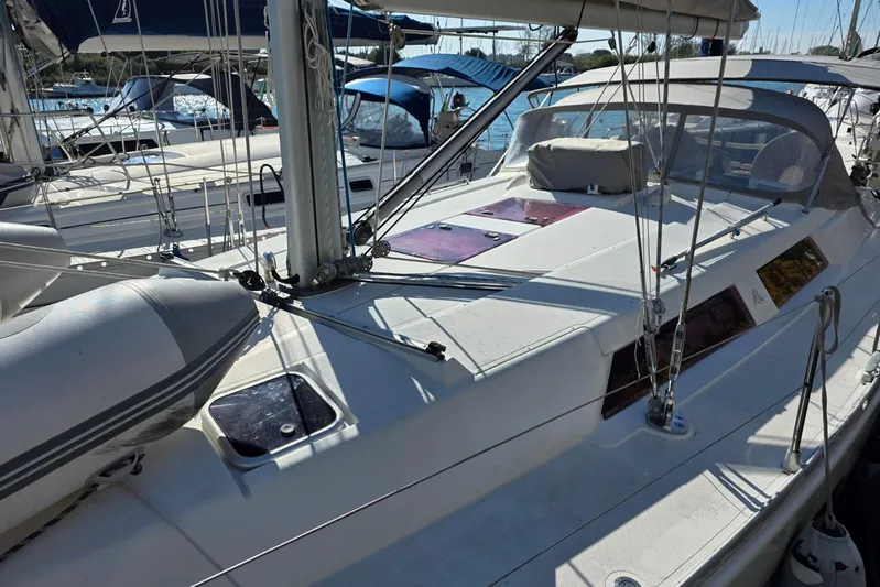  Yacht Photos Pics 2010 Hanse 400e sailboat deck with rigging and hatches in a marina setting.