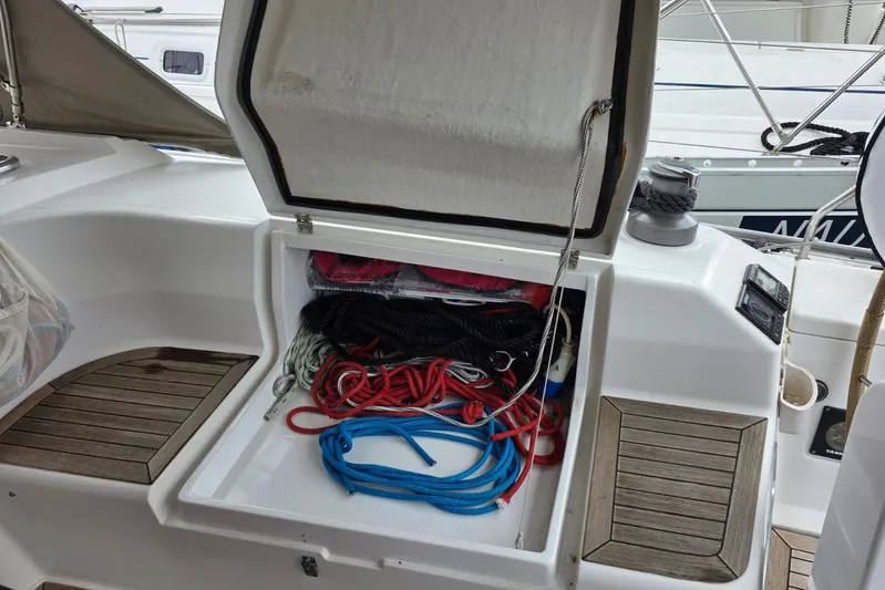  Yacht Photos Pics Open storage compartment on 2010 Hanse 400e sailboat with colorful ropes inside.