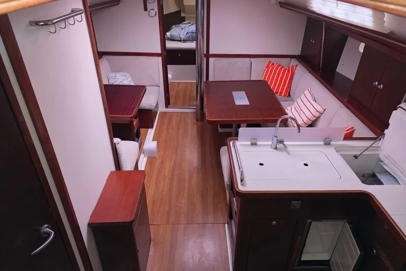  Yacht Photos Pics Interior of 2010 Hanse 400e yacht with cozy seating and modern kitchen area.