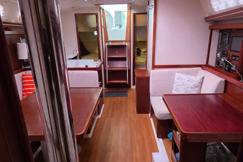  Yacht Photos Pics Interior of 2010 Hanse 400e yacht with wooden furnishings and cozy seating area.