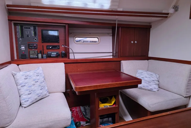  Yacht Photos Pics Cozy interior of 2010 Hanse 400e sailboat with seating and control panel.