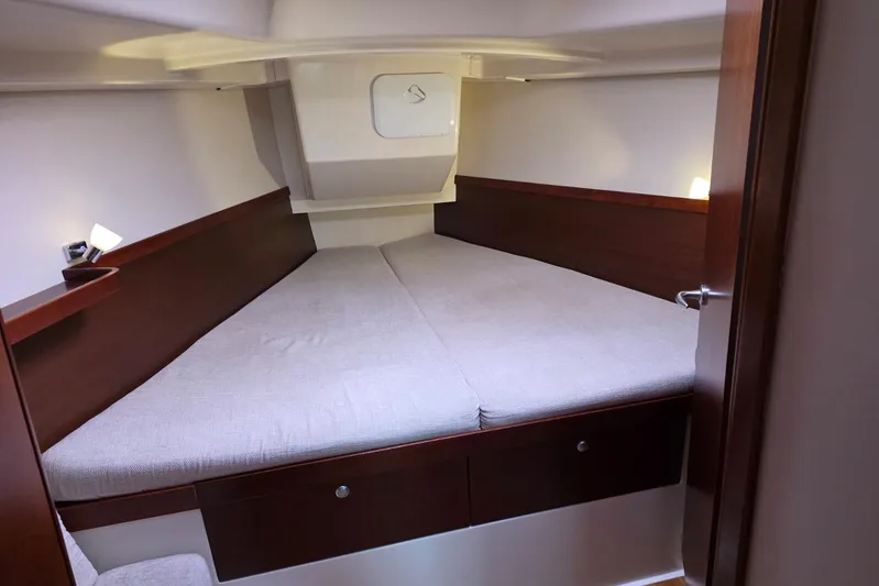  Yacht Photos Pics Cozy cabin interior of 2010 Hanse 400e yacht with comfortable bedding.